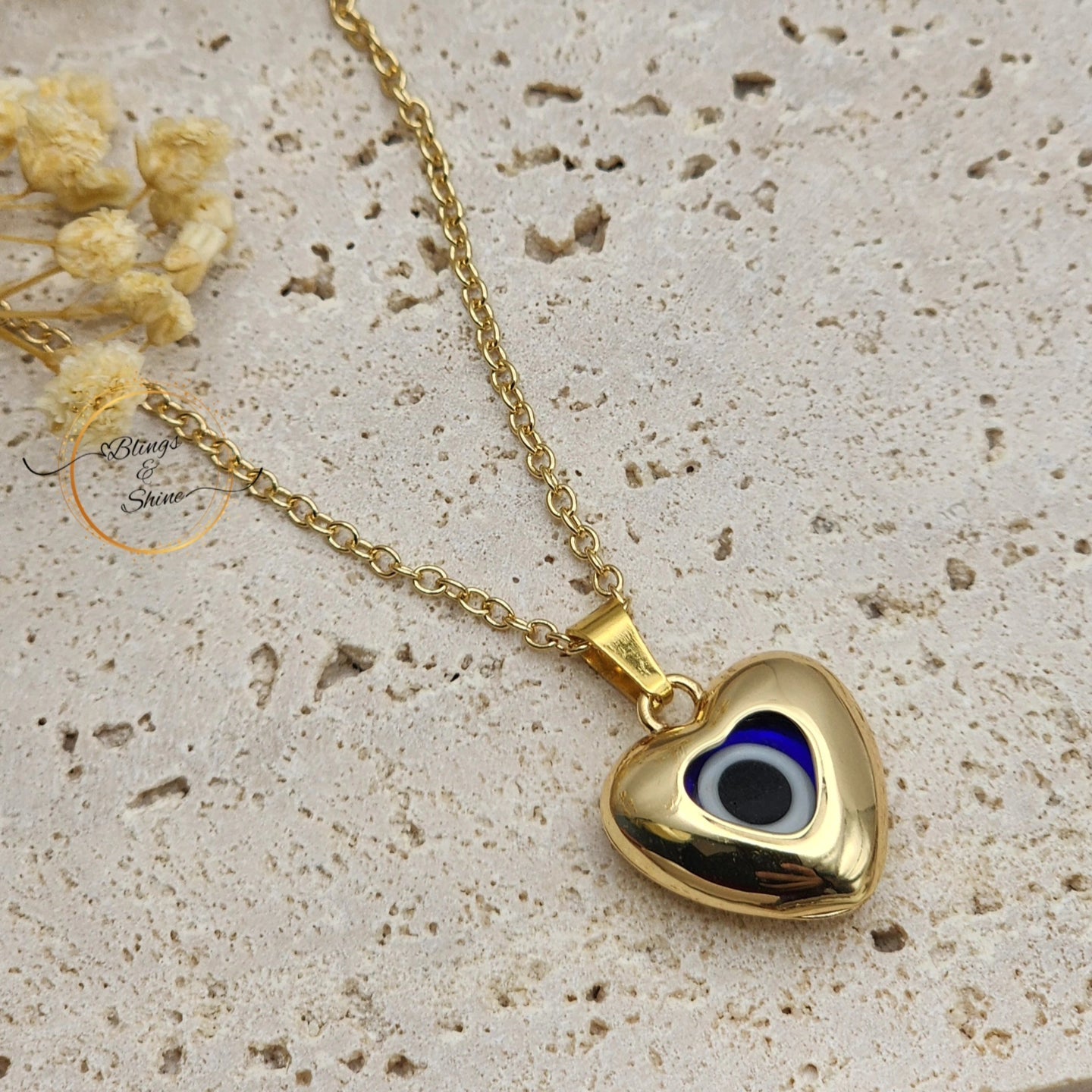 Evil eye heart pendant