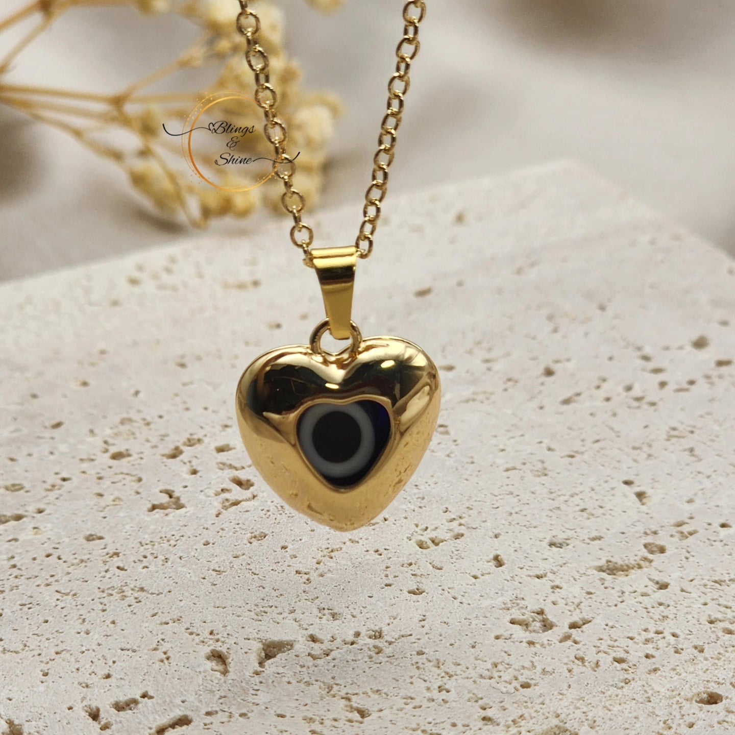 Evil eye heart pendant