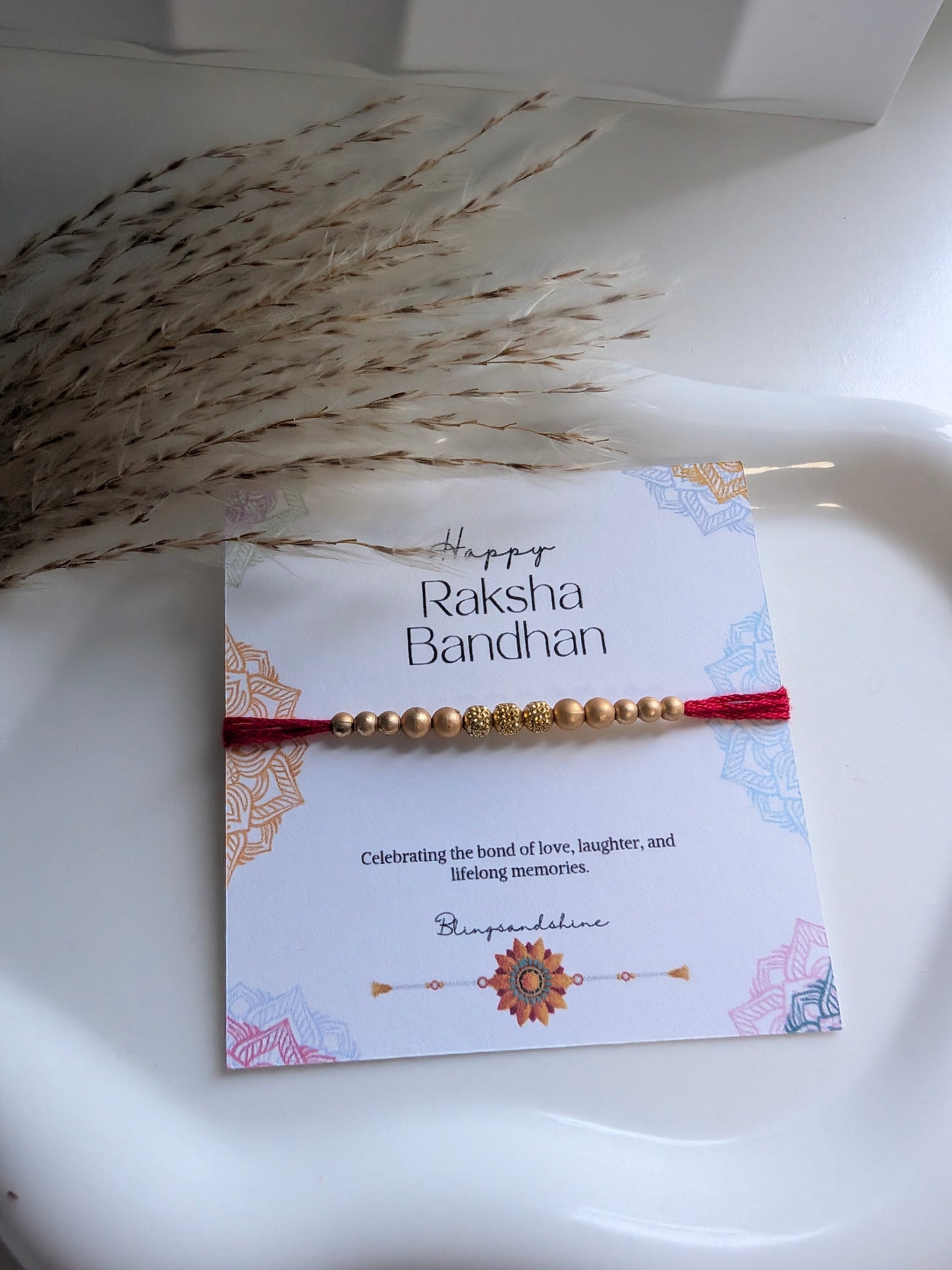 Gold beads thread rakhi